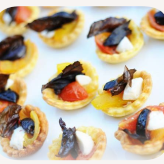Tartlet with cherry tomato, baby mozzarella and basil